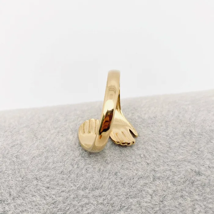 Hands Cuddling Gold Plated Stainless Steel Ring Mio Queena Rings