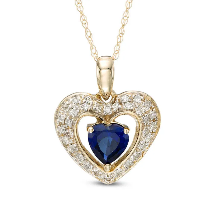 50mm HeartShaped LabCreated Blue Sapphire and 013 CT TW Diamond Frame Heart Pendant in 10K Yellow Gold Goldia Necklaces 50mm HeartShaped LabCreated Blue Sapphire and 013 CT TW Diamond Frame Heart Pendant in 10K Yellow Gold Goldia Necklaces