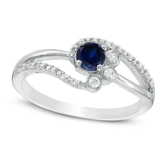 Goldia Rings 40mm LabCreated Blue Sapphire and 007 CT TW Diamond BezelSet Side Accent Bypass Promise Ring in Sterling Silver