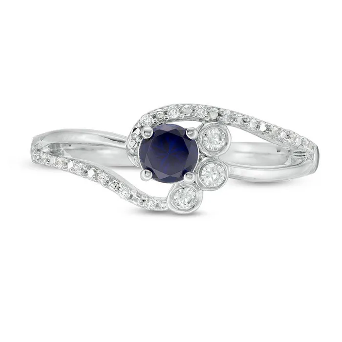 Goldia Rings 40mm LabCreated Blue Sapphire and 007 CT TW Diamond BezelSet Side Accent Bypass Promise Ring in Sterling Silver Goldia Rings 40mm LabCreated Blue Sapphire and 007 CT TW Diamond BezelSet Side Accent Bypass Promise Ring in Sterling Silver